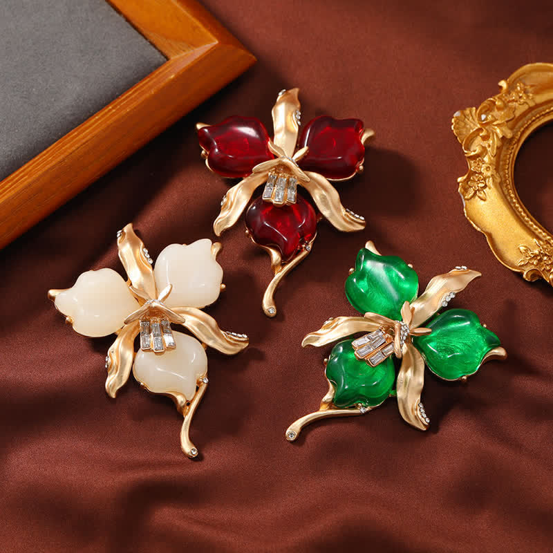 Spilla da donna in ottone metallizzato con fiore di orchidea in resina a forma di petalo - image 1