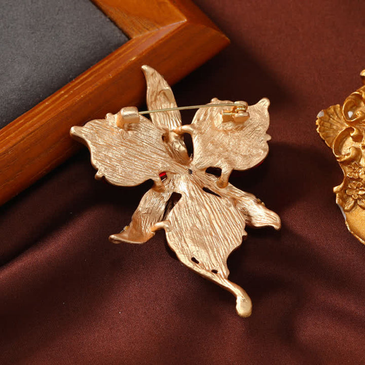 Spilla da donna in ottone metallizzato con fiore di orchidea in resina a forma di petalo - image 2
