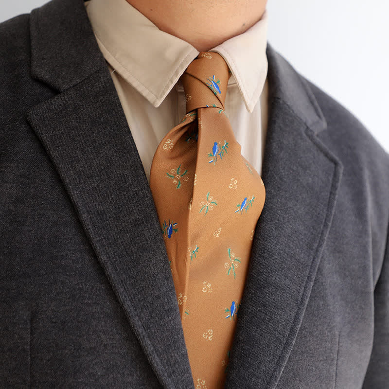 Cravatta da uomo con uccellino blu e piccoli fiori bianchi arancione scuro - Arancione scuro - image 0