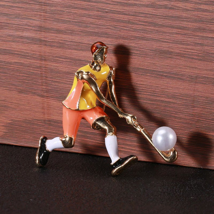 Spilla da giocatore di hockey su ghiaccio dei cartoni animati Accessori per magliette dorate - image 1