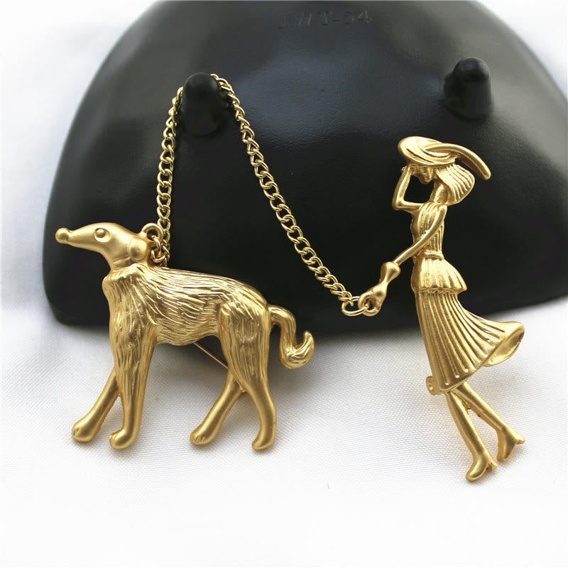 Spilla a catena in oro con dama e cane - image 0