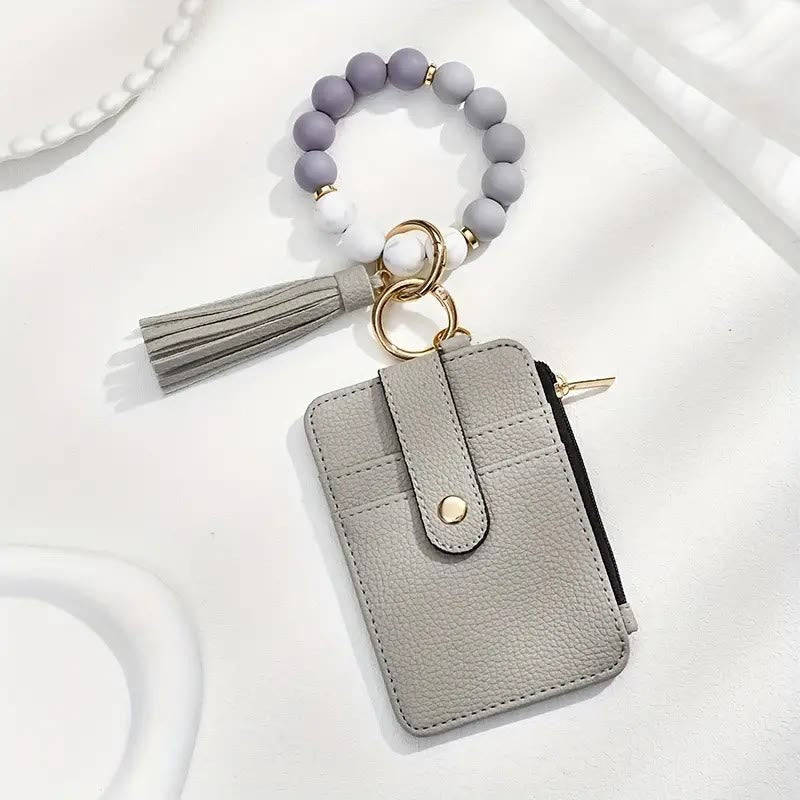 Elegante portachiavi da polso con nappina e perline. - Grigio - image 6