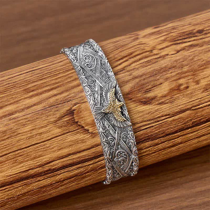 Bracciale a polsino aperto con aquila occidentale e incisioni a volute. - image 2