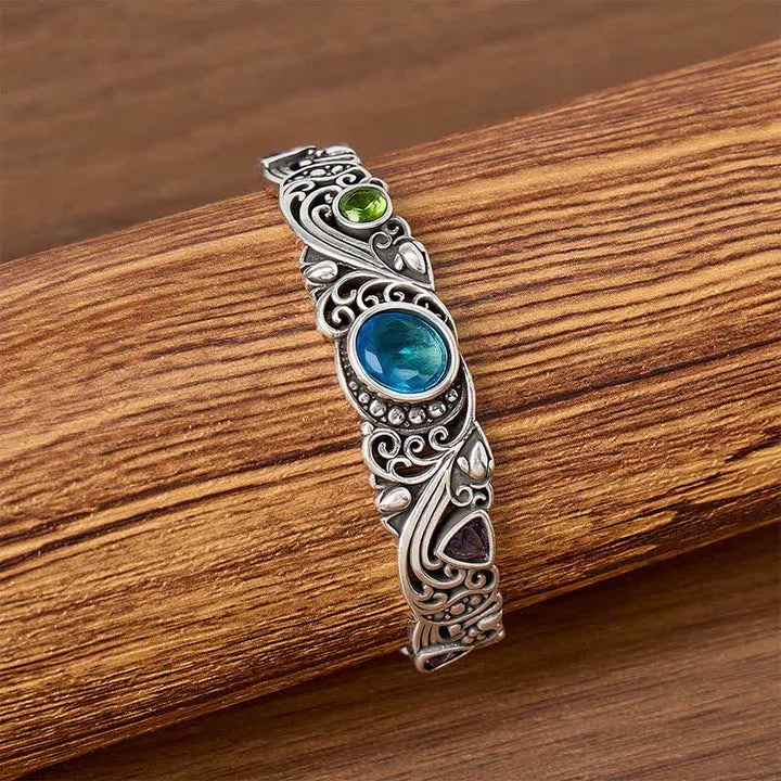 Bracciale a polsino aperto con pietre preziose decorate. - image 2