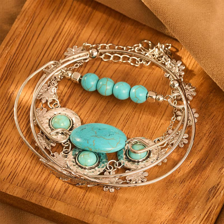 Set di 5 braccialetti impilabili Desert Muse con piume turchesi e fiori - image 1