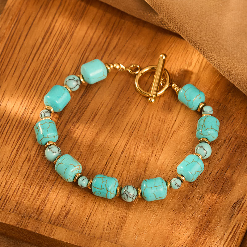 Bracciale vintage boho con perline turchesi a barilotto e chiusura a moschettone color oro. - image 1