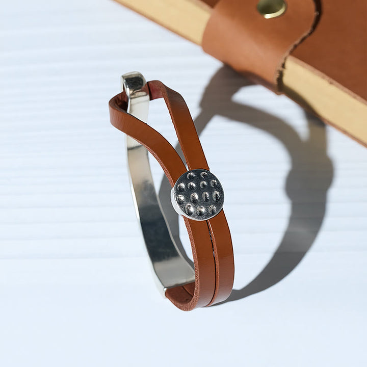 Bracciale da uomo moderno e minimalista in metallo e pelle. - image 0