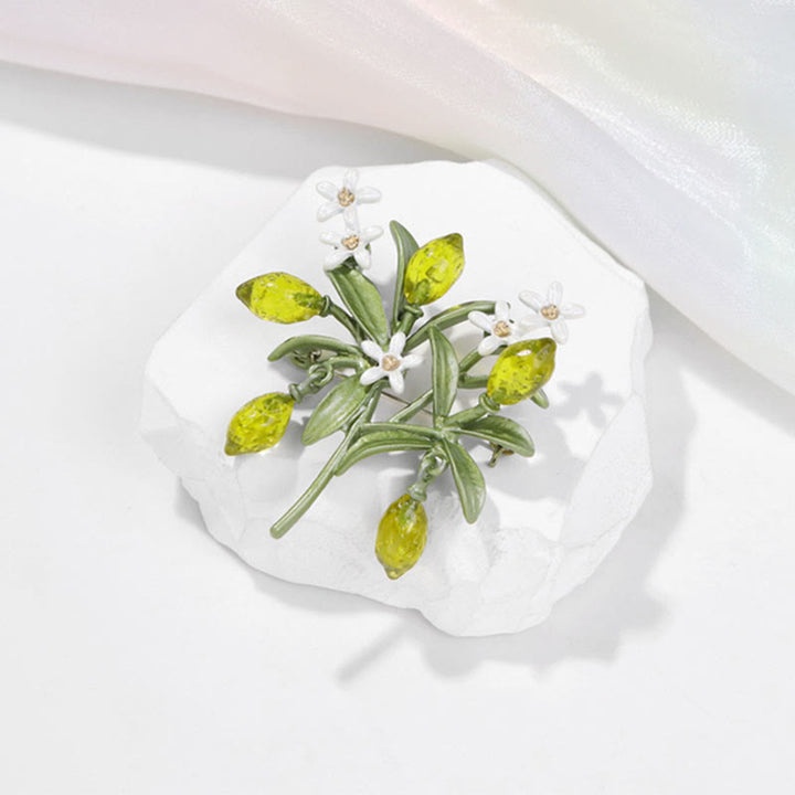 Spilla da donna a forma di goccia di limone con pianta verde - image 2